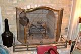 Firescreen and antique fireplace fender; electric lighted logs