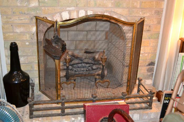Firescreen and antique fireplace fender; electric lighted logs