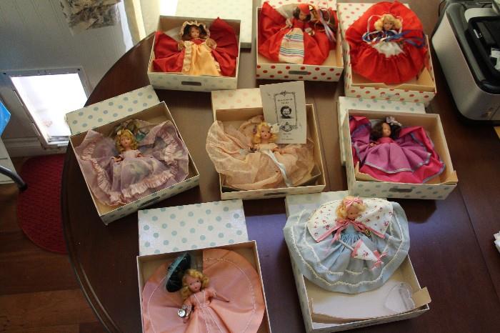 Nancy Ann dolls, excellent condition, in original boxes, with tags still on wrists. One with paper insert, several with stands. Some bending legs, some straight legs.