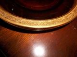 DETAIL OF GOLD RIM ON DESSERT PLATES