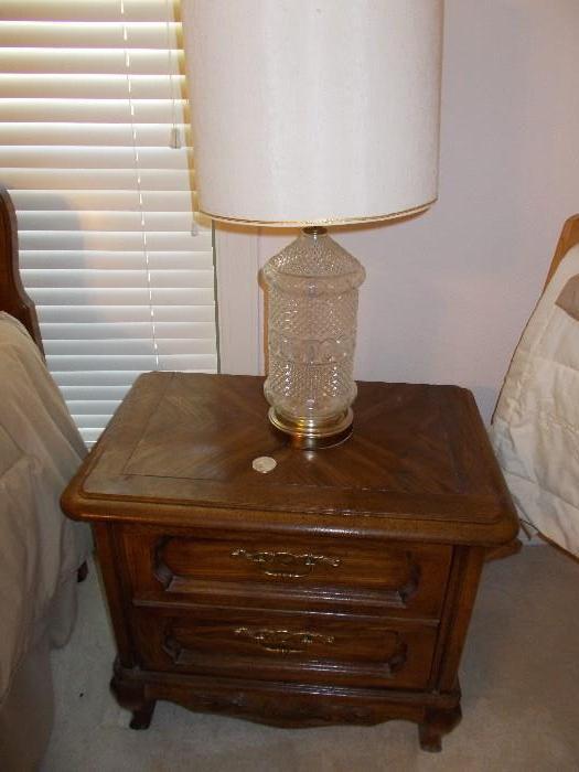 One of a pair of matching bedside night stands - one of a pair of crystal lamps
