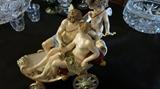 Meissen figurine with Apollo with wings, nude lady with cherubs and rolling wheels!