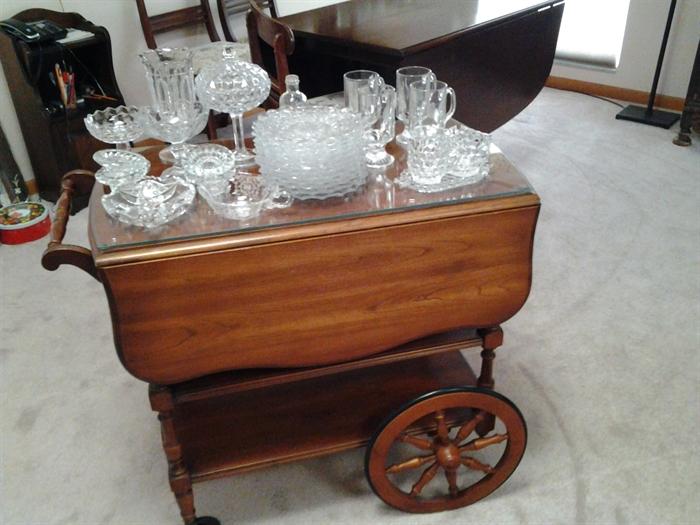 Wheeled tea cart loaded with beautiful g;assware