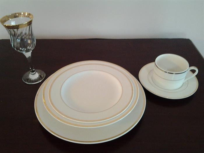 China - service for 8 shown with gold trimmed stemware