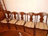 Set of mahogany color chairs with two captain's chairs
