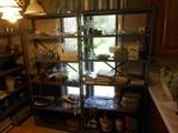 Several shelves of kitchen accessories, showing 2 of 5, cookbooks, small appliances 