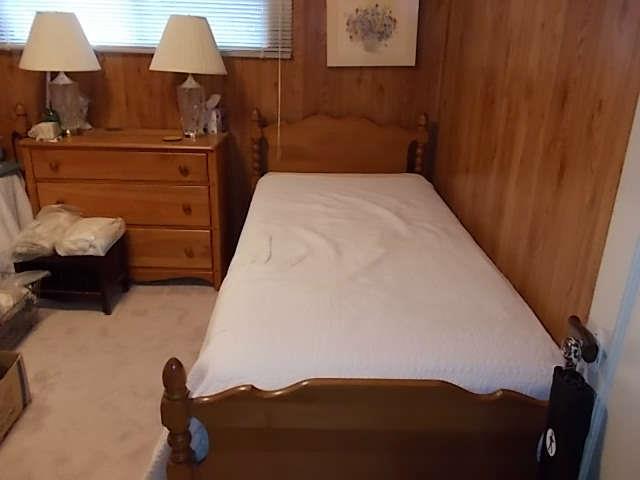 Two twin beds, dresser, lamps.