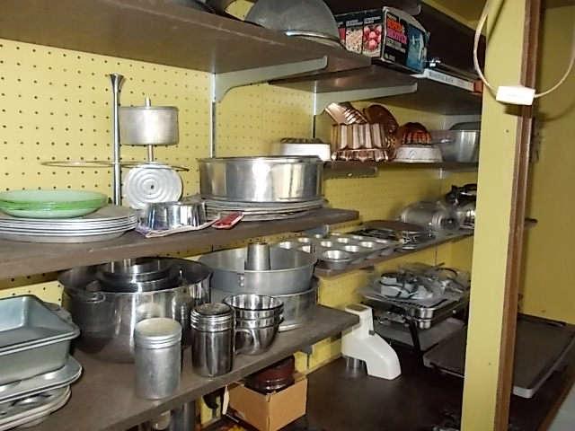 Lots of pots, pans and cooking utensils.