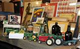 Better picture of all the Ertl Tractors, Planters Peanuts Glass Jar and some nice vintage Olive Green Blob Bottles.