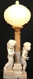 Lot 1012:  ROMANELLI, Pasquale, (Italian, 1812-1887): ''A Game of Blind Man's Bluff'', Marble/Alabaster, approximately 35'' h., incised signature, removable carved shade. Est. $2500/4000**
CONDITION: Scattered repairs throughout, most notable to fingers of several of the figures.