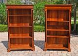 Lot 1244:  PAIR OF CHERRY BOOK CASES: Each with ebonized full column stiles, 3 adjustable wood shelves, bracket front feet. 72 3/4'' x 42 1/2'' x 13 1/4''.
CONDITION: Split to one shelf.