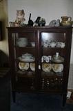 Nice antique china cabinet, chalkware cats, china, crystal, yellow rose advertising plates(each from a different town).