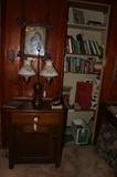 Victorian print of girl with dog, miscellaneous books, brass double shaded lamp with painted shades, nice primitive cabinet.