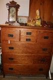 Huge beautiful pine (?) chest of drawers with new hardware, 1950's kids baseball mitts, mantle clock (works).