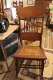 Cane-seat antique oak rocker.