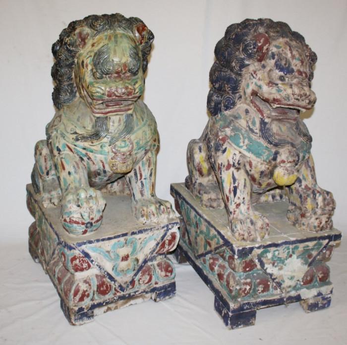 Pair of Chinese polychrome carved wood foo dogs