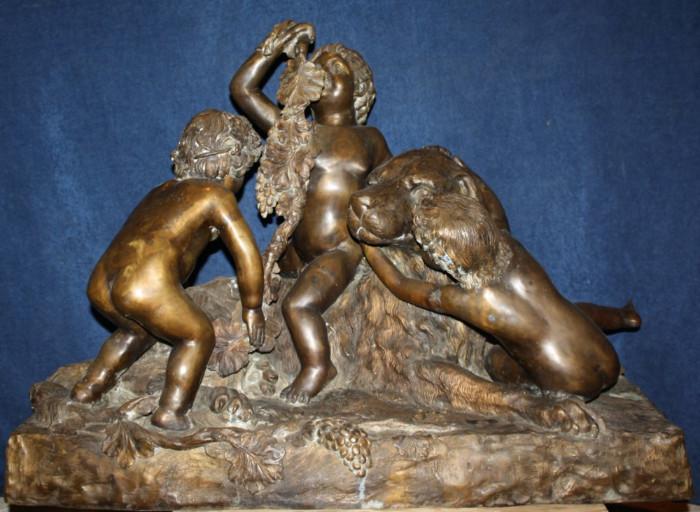 Bronze sculpture depicting 3 children with dog 
