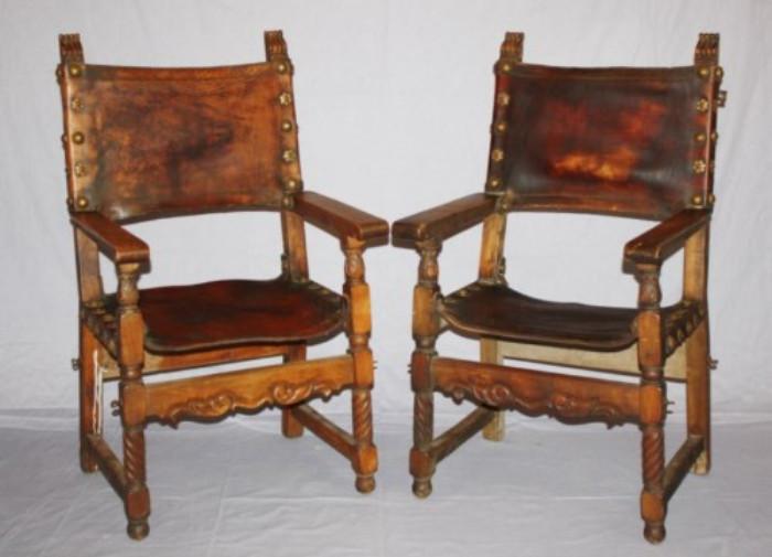 Pair of Spanish oak and leather armchairs 