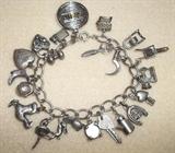 Vintage silver charm bracelet with 22 charms, all sterling.