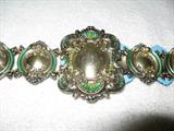 Victorian, sterling silver belt in Louis XIV style. Enhanced with translucent green enamels. Back side with solid layer of bluish enamel. Why, I don't know.