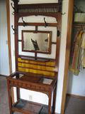 Hall bench with tile back and suspended mirror.