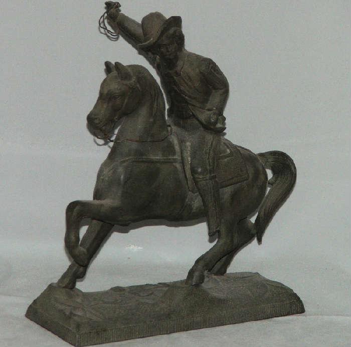 Old Metal Cowboy on Horse Sculpture 