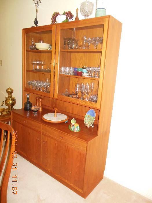 Teak Wood, Danish,China cabinet has 2 doors, each having 3 shelves behind glass.The bottom has  doors and drawers , for good storage.