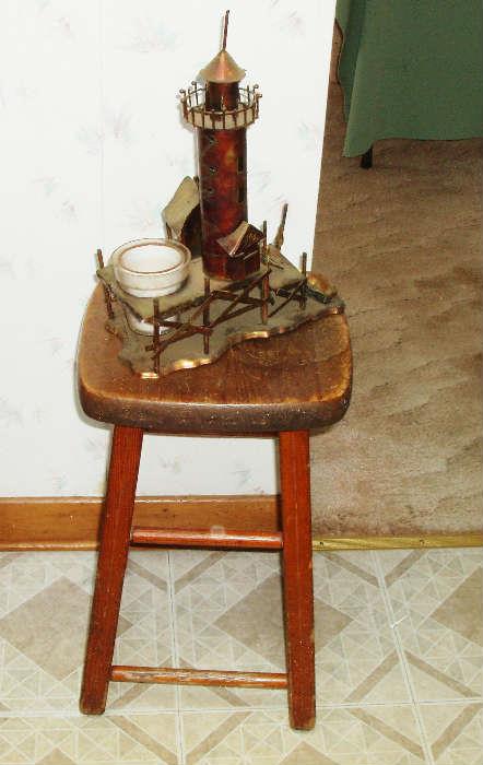vintage wooden stool and beach art 
