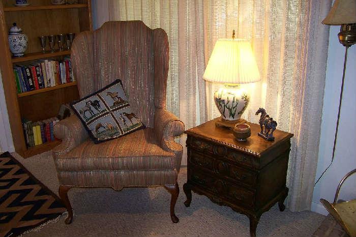 Second of the pair of wing chairs shown with one of the pair of carved 3 drawer end tables/chests