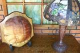 Turtle shell on a plaque along with a reproduction Tiffany lamp