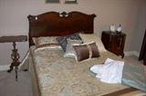 Beautifl double bed - nice carved accents on both the headboard and the footboard.  
