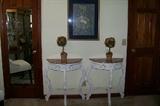Pair of new painted consoles with marble tops.  These are found in the room upstairs