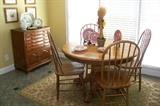Very nice American oak table with four chairs.  Also pictured is a very unusual silverware chest - 