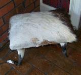 Animal skin covered horn stool
