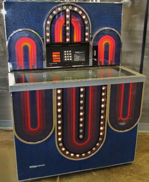 This is a 1977 "SEEBURG Mardi Gras STD4 160" Jukebox in Working Condition. It Plays 45's and you get Extra Records with the Jukebox.                                            54" tall 40" wide 27" deep 