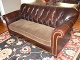 •	Chocolate Brown Leather Sofa, Tufted Back, Rolled Arms, Brass Hobnail Trim, Turned Legs, Velvet Cushion w/ Suede Cording, 80"W X 38"D (from Madden McFarland)