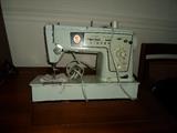 singer sewing machine in cabinet