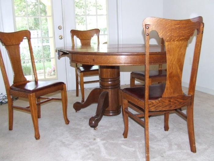 Oak pedestal table and t-back chairs