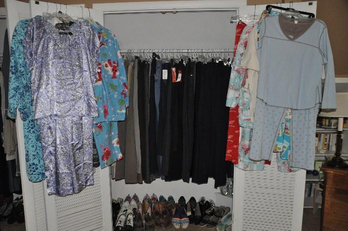 A closet full of women's pants and dozen of pajamas