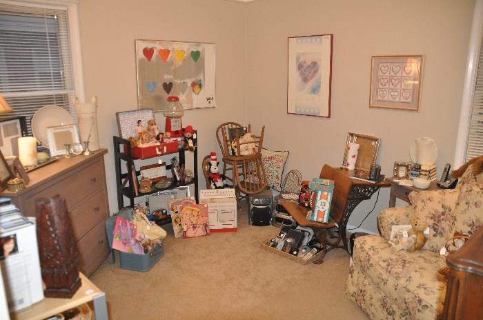 Room filled with toys, electronics, a fantastic Quatrine over sized chair and more!