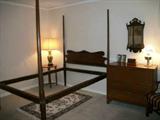 Antique pencil post bed, Chippendale mirror, antique cherry chest