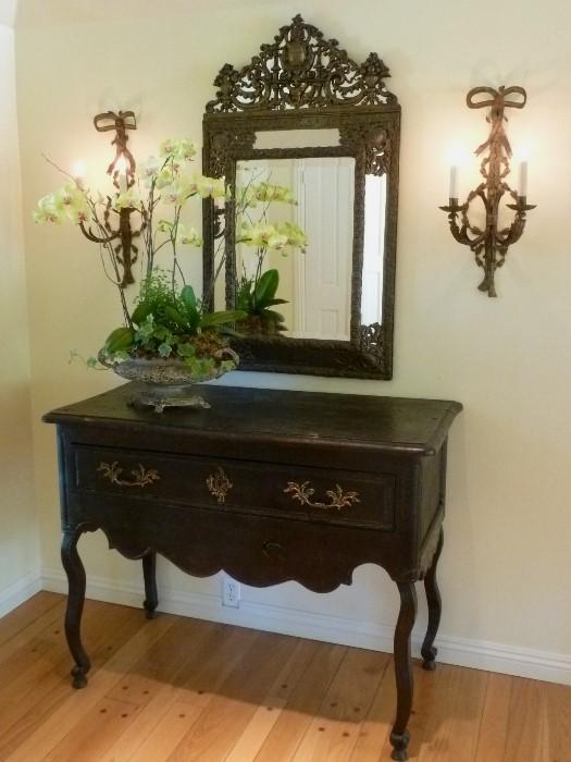 French Louis Philippe mirror, 1860s and ebonized provincial buffet.