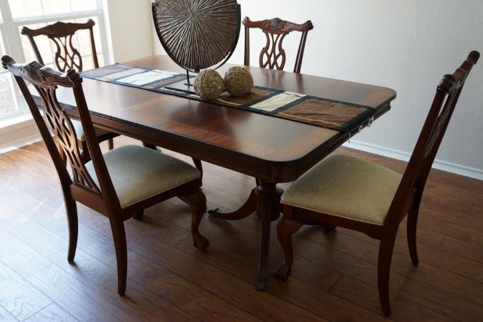 Gorgeous Duncan Phyfe double pedestal style table with 8 chairs. Accessories not included.