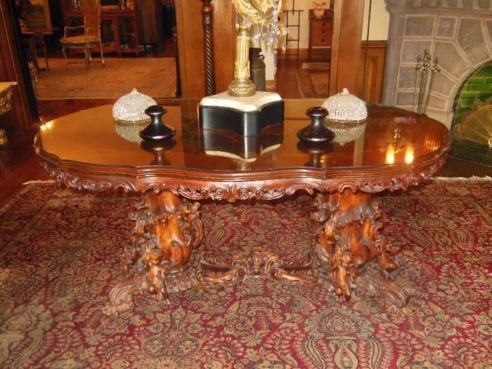 Antique German Carved & Inlaid Center Table with a Pair of Art Nouveau Loetz Glass Bud Vases and a Pair of Antique Crystal-Bead Domes on a 1920's Palace Size American Persian-Style Carpet