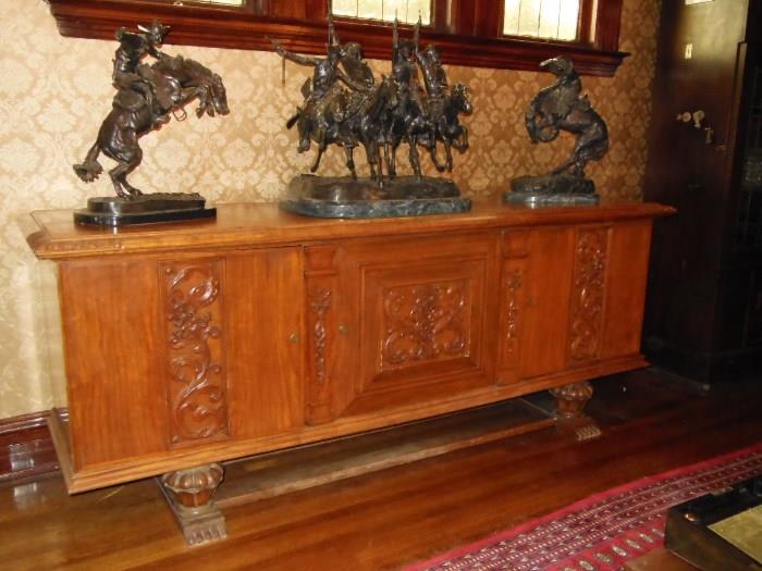 A 1930's Sideboard with a gentle Deco influence and Three Bronzes by Remington
