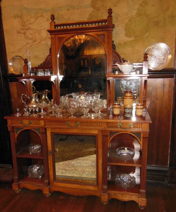 A Victorian Sideboard with an assortment of Crystal