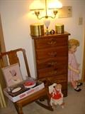 Cane seat rocker, 6 drawer narrow pine chest, milk glass lamp, dolls, etc.