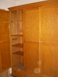 Oak 3-door storage cupboard with board and bead back.  This was salvaged from a Muskegon school