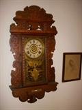 "Eureka" model by E. N. Welch oak gingerbread wall hanging gingerbread clock, complete with level in base, in working order