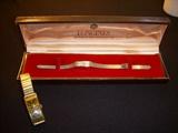Longines ladies' 14k white gold case watch with gold filled band in original box.  Gruen Curvex man's driving watch (works).